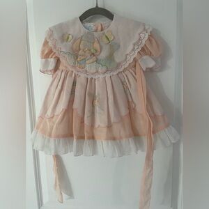 Vintage Narci Imports baby girls dress, with an embroidered rabbit and carrot.